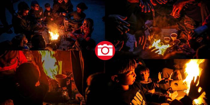 Gazzeliler ayakları çorapsız, ateşin etrafında ısınmaya çalışıyor